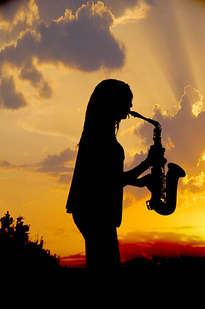 istock girl playing the saxophone 529050982