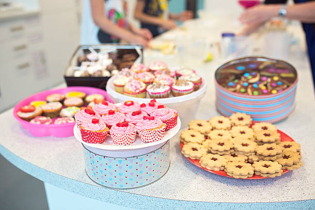 Bake Sale Cookies, Muffins and Cakes. Home made baked goodies for bake sale on the table. bake sale stock pictures, royalty-free photos & images