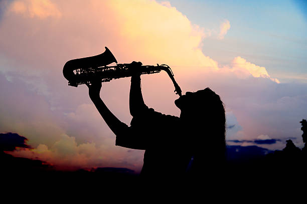 istock girl playing the saxophone 529051506