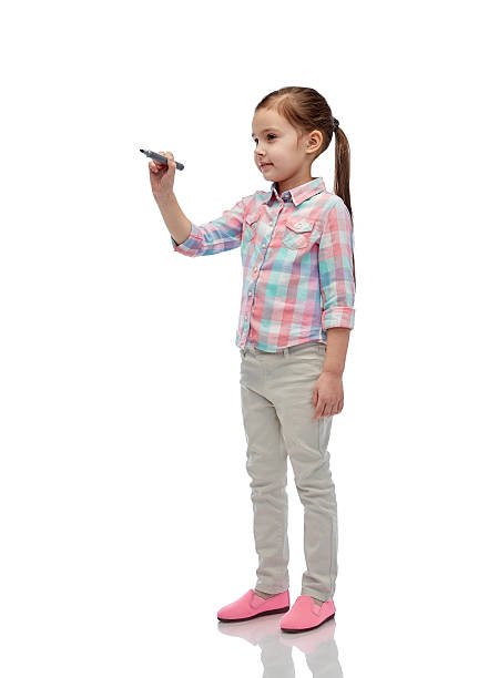 istock little girl drawing or writing with marker 529051942