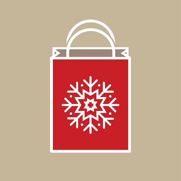 Christmas Holiday Gift Bag Silhouette of a Christmas holiday gift bag with snowflake ornament decoration on light beige background. silhouette symbol computer icon shopping bag stock illustrations
