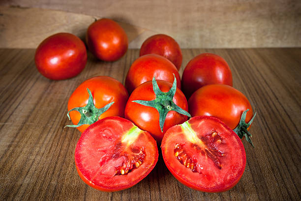 istock Close-up fresh ripe tomatoes on wood background 529053804