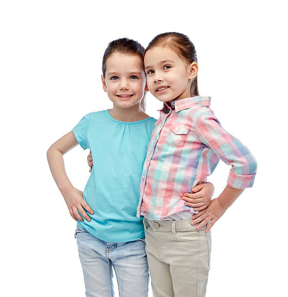 istock happy smiling little girls hugging 529054226