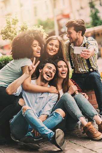 Five friends taking a selfie.