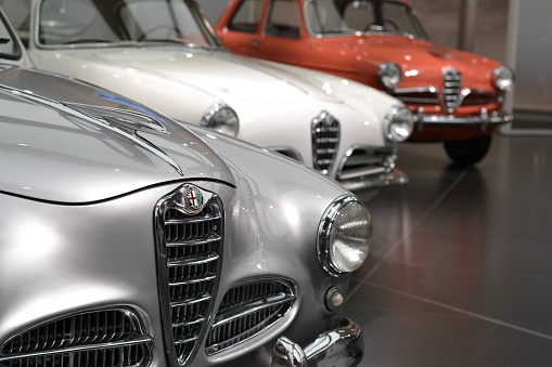 Milan, Italy - February 24th, 2016: The presentation of Alfa Romeo classic vehicles in the car museum. These vehicles are the most wanted and rare classic cars with 50s. On the first plan we see the Alfa Romeo 1900. On the back we see the models: 1900 Super Sprint and Giulietta.