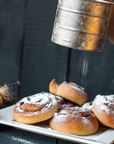 istock sprinkle with powdered sugar and cinnamon buns, raisins and nuts 529054887