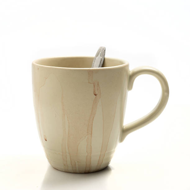 istock Used coffee cup isolated on white background 529056360