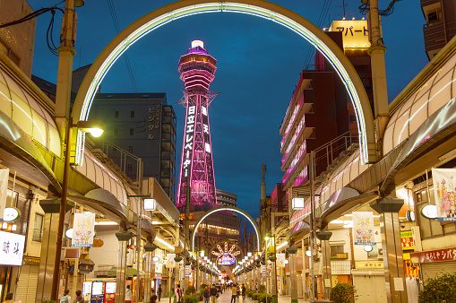 Osaka Japan- April 13, 2016: Tsutenkaku is a tower and well-known landmark of Osaka Japan and advertises Hitachi. It is located in the Shinsekai district of Naniwa-ku Osaka.