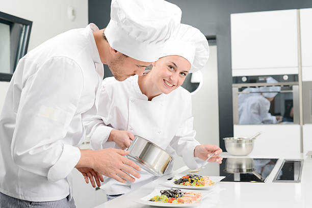 istock student and teacher in professional cook school kitchen preparing dish 529059274