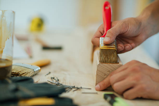 istock Carpenter Painting Furniture. 529060016