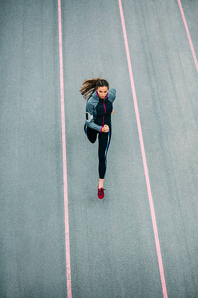 Running athlete Sports woman running on asphalt track. pedometer photos stock pictures, royalty-free photos & images