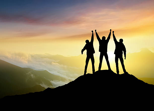 istock Silhouettes of team 529060894