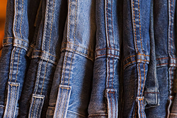 istock Jeans on a white wooden background. 529062004
