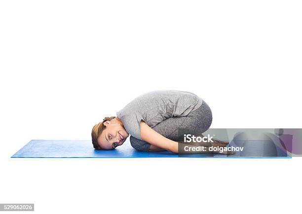 Happy Woman Making Yoga In Child Pose On Mat Stock Photo - Download Image Now - Active Lifestyle, Adult, Adults Only