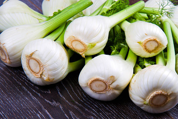 istock Fresh fennel on wooden background 529062222