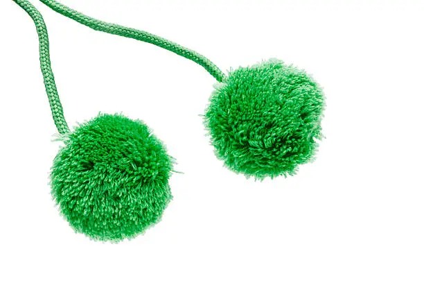 Green fluffy pompons isolated over white