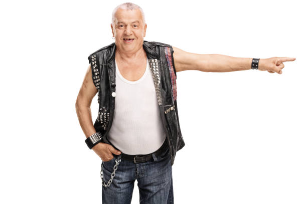 A waist-up shot of a young male adult athlete with his arms folded. He is a quadruple amputee who developed Meningitis as a baby, looking into the camera wearing a blue navy vest with a positive expression on his face—a white background in a studio.