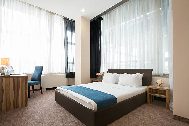 istock Elegant hotel bedroom interior 529063078