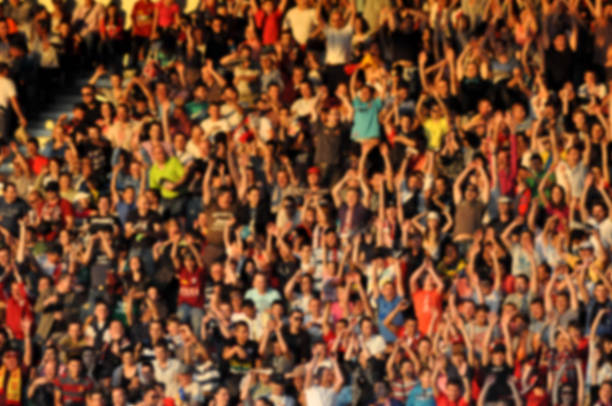 istock Crowd in a stadium. Blurred heads and faces of spectators 529063548