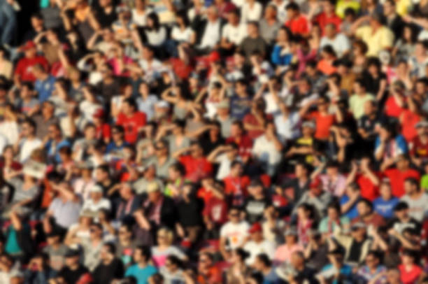 istock Crowd in a stadium. Blurred heads and faces of spectators 529063568