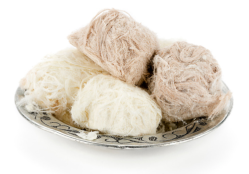 Traditional Turkish cotton candy called Pismaniye in vintage plate isolated on white background. 