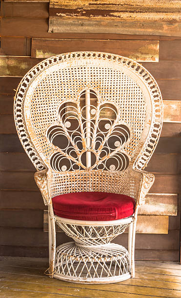 Wicker chair on wood wall background.
