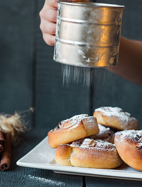 istock sprinkle with powdered sugar and cinnamon buns, raisins and nuts 529066839