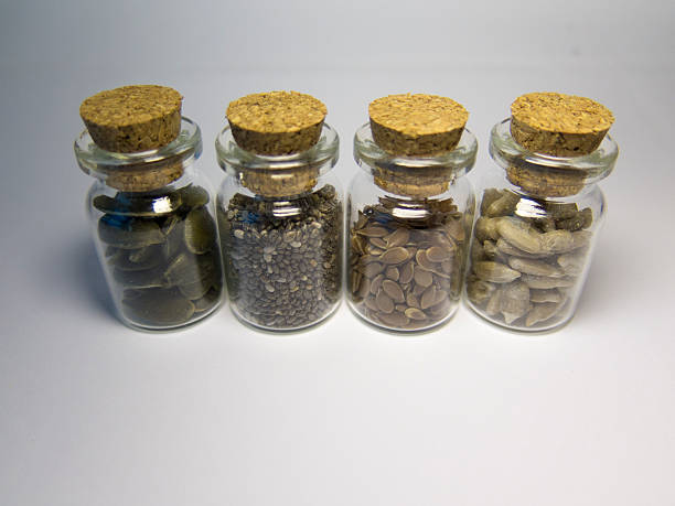 istock Useful seeds in jars on a white background 529068854