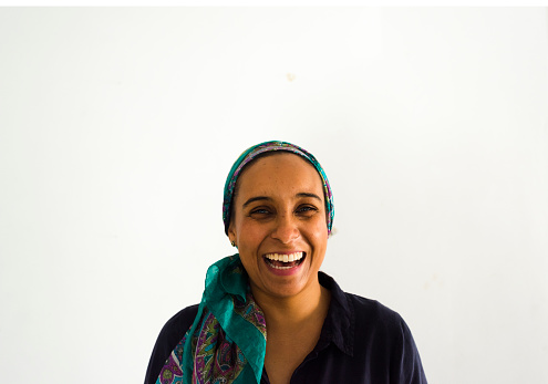Portrait Of A Laughing Muslim Woman Wearing A Headscarf Stock Photo ...