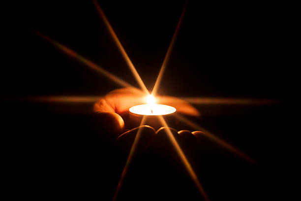 Photography of a hand holding a candle with a glowing star. No arfiticial layers / filters added. Impress your clients with this sophisticated and elegant design.