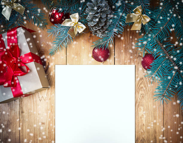 istock Christmas toys and gift box pine tree on wooden background 529069737