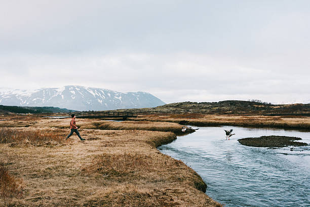 Man walking near the river 