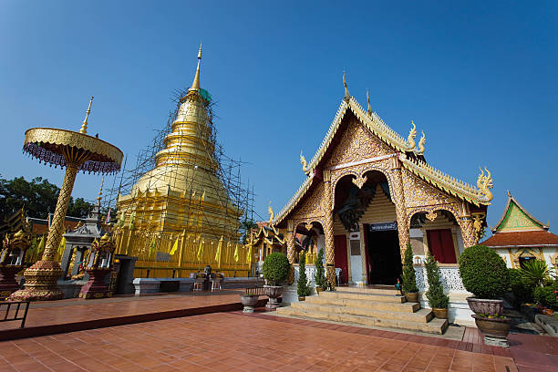 golden pagoda,Wat Phra That Haripunchai in Lamphun while repairs stock photo