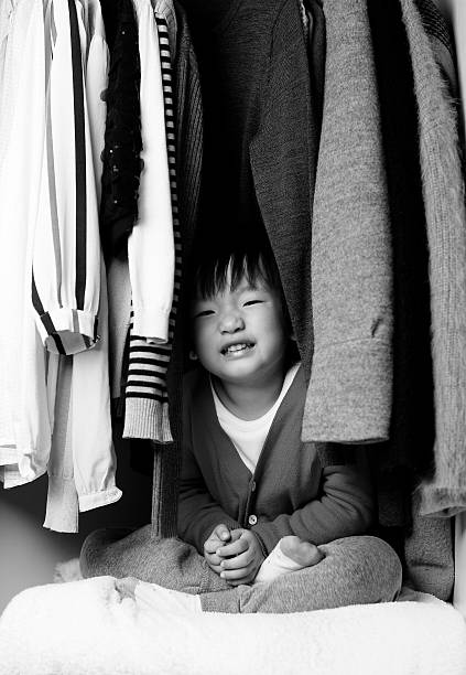 istock Child playing in the closet 529071144