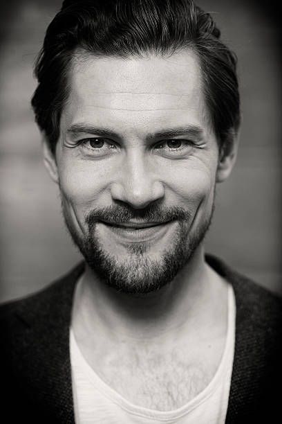 istock Smiling handsome man in black and white shot 529071780