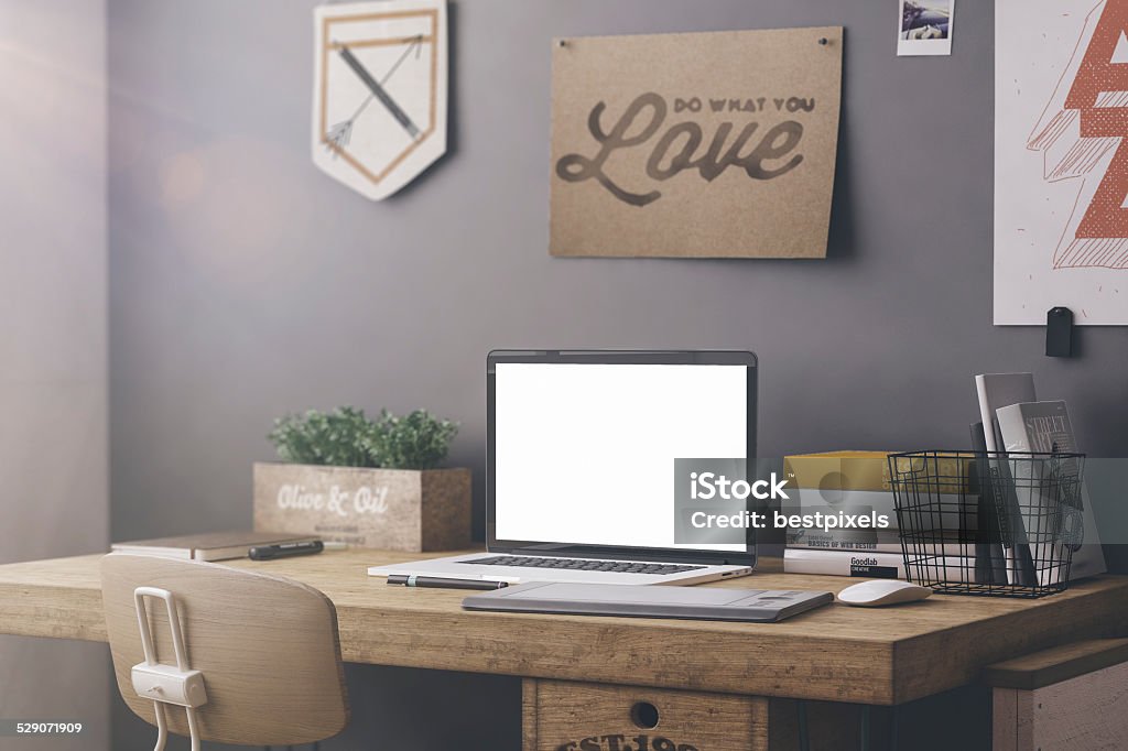 Stylish workplace mockup Stylish workspace with computer and posters on home or studio Arranging Stock Photo