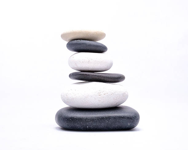 istock Black and White pebbles isolated on a white background 529072475