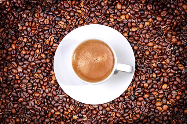 istock coffee grains  and a cup of coffee 529072844