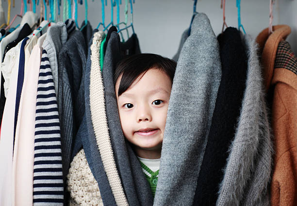 istock Child playing in the closet 529073250