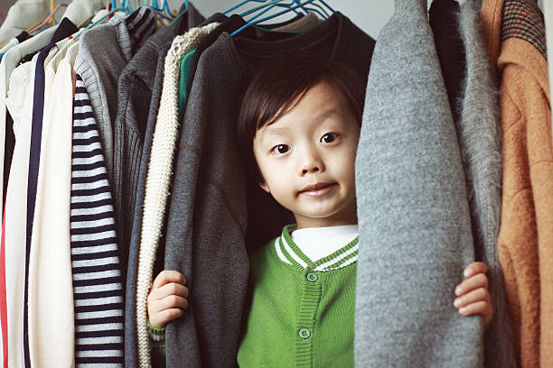 istock Child playing in the closet 529073338