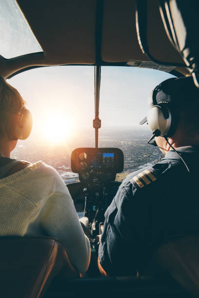istock Pilots flying a helicopter on sunny day 529073592