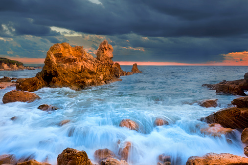 Sunset at Laguna beach, California. Motion Blur from the waves crashing in and the long time exposure