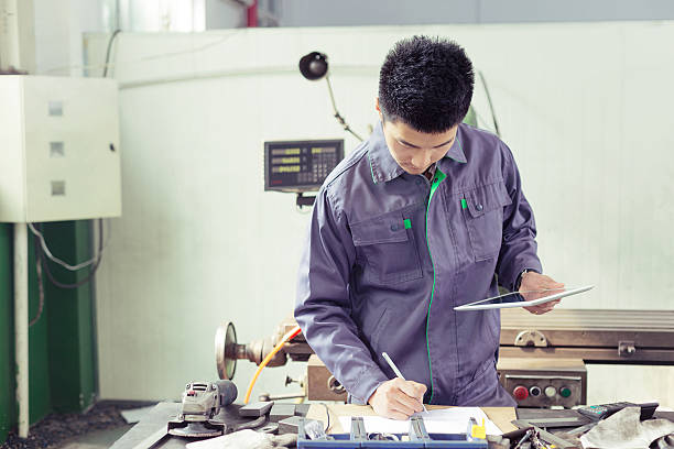 istock mechanic  worker using tablet in workshop of factory 529078811