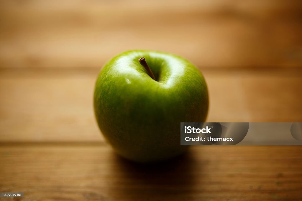 Green apple on wood Green apple on wood. Apple - Fruit Stock Photo