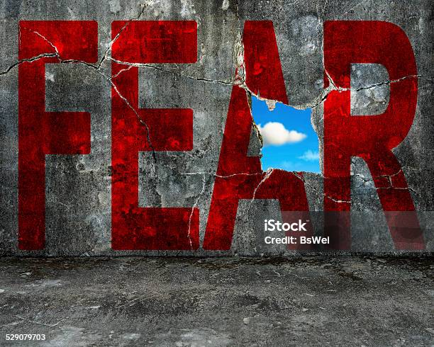 Red Fear Word On Grey Grunge Concrete Wall Stock Photo - Download Image Now - Fear, Conquering Adversity, Hope - Concept