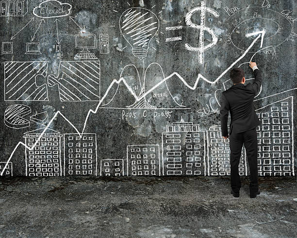 istock businessman drawing business concept doodles on old concrete wal 529079725