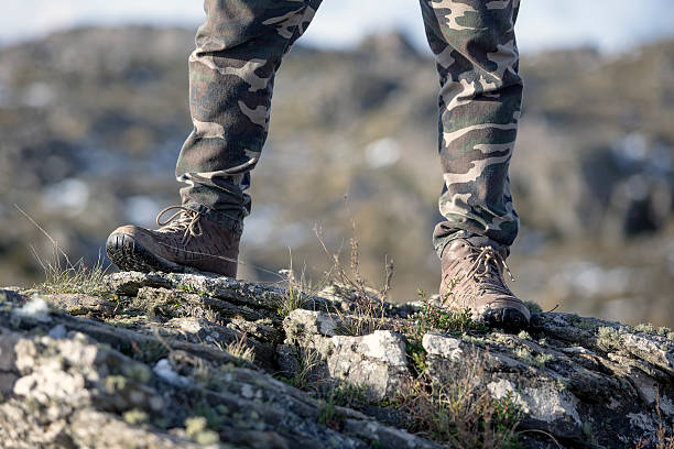 istock Hiking boots at mountain rocks 529079852
