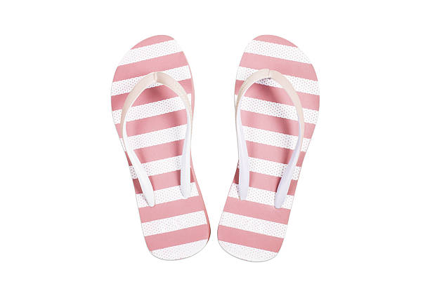 istock Pink flip flop sandals beach shoes isolated on white. 529080529