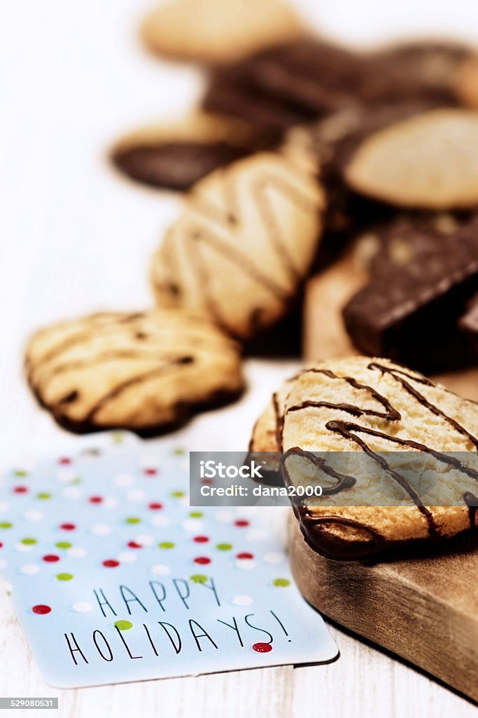 Christmas Cookies Christmas cookies and a greeting card on white background. Celebration Stock Photo