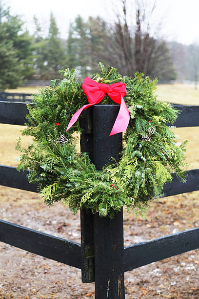 istock Holiday Wreath on Corner Fence Post 529081553